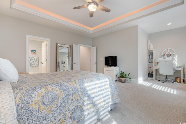 bedroom with carpet, ceiling fan, and a tray ceiling