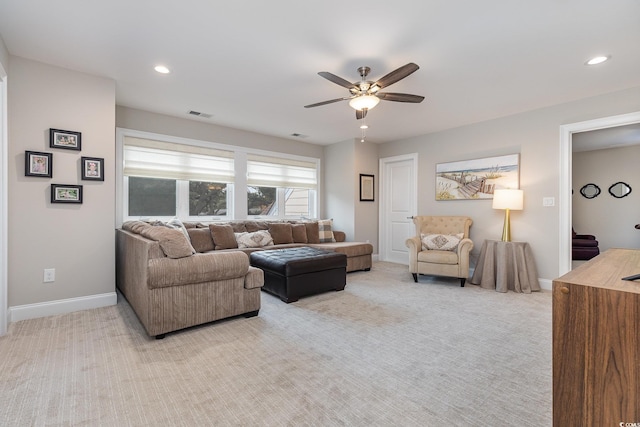 carpeted living room featuring ceiling fan