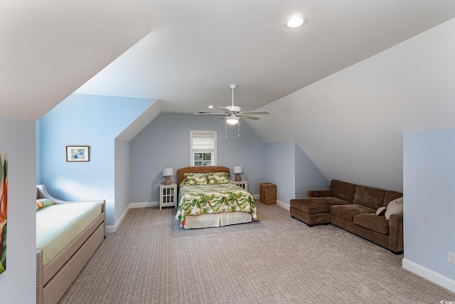 bedroom with lofted ceiling, light colored carpet, and ceiling fan