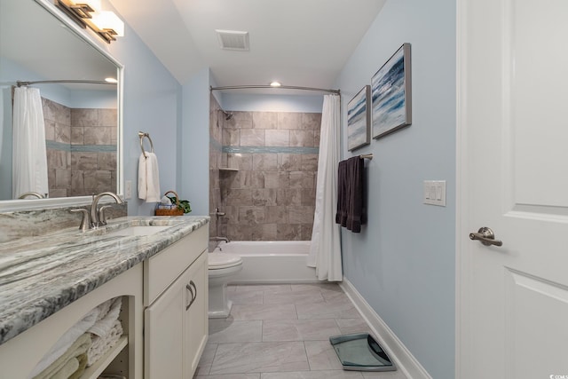 full bathroom featuring shower / bath combo with shower curtain, vanity, and toilet