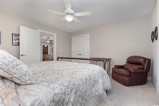 bedroom featuring light carpet and ceiling fan