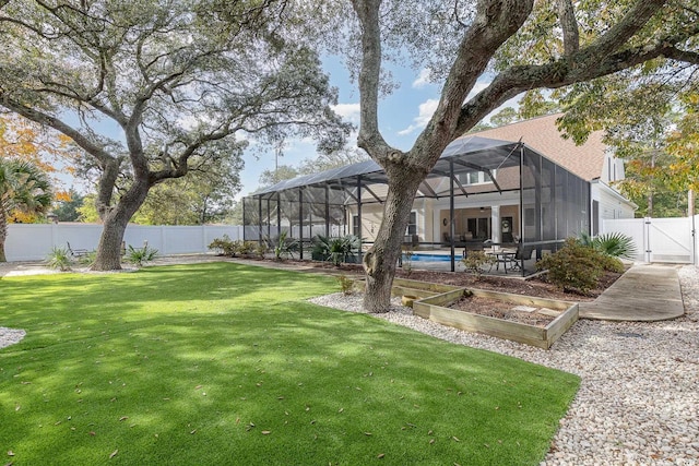 view of yard featuring a fenced in pool and glass enclosure