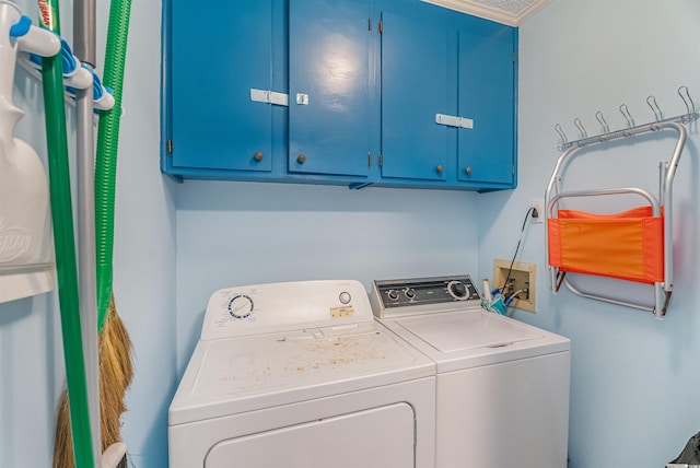 laundry area with cabinets and independent washer and dryer