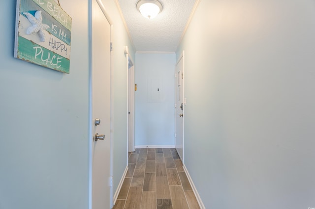 hallway with a textured ceiling