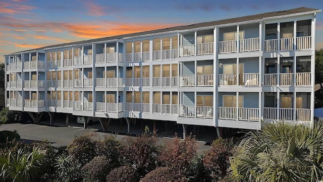 view of outdoor building at dusk