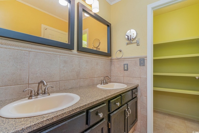 bathroom featuring tile walls, vanity, tile patterned floors, and crown molding