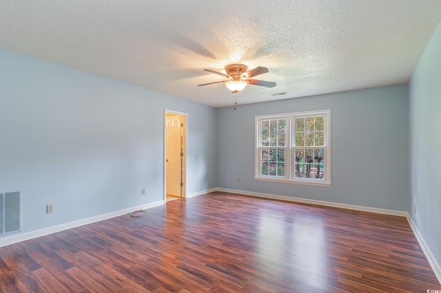 spare room featuring ceiling fan, a textured ceiling, and dark hardwood / wood-style floors