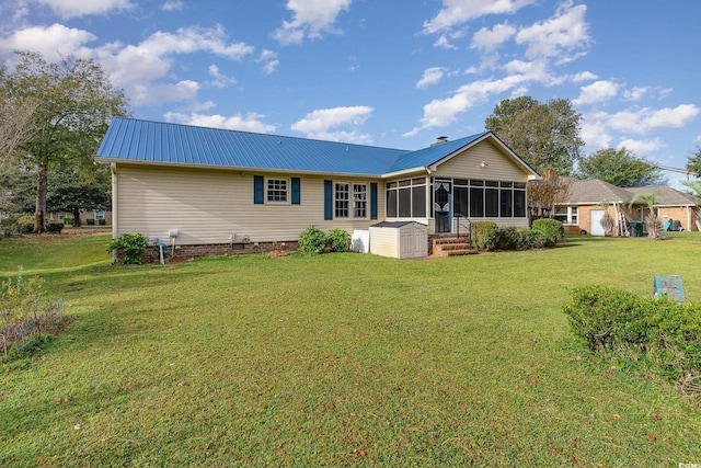 rear view of property with a sunroom and a yard