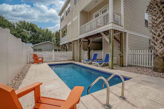 view of swimming pool featuring a patio