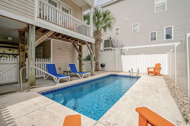 view of swimming pool with a patio