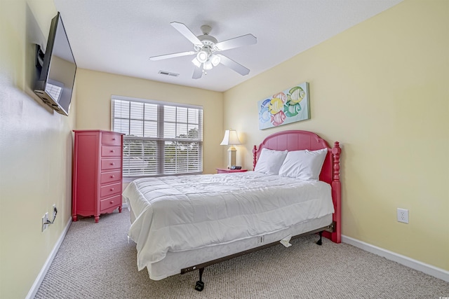 bedroom featuring light colored carpet and ceiling fan