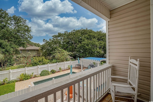 balcony featuring a pergola