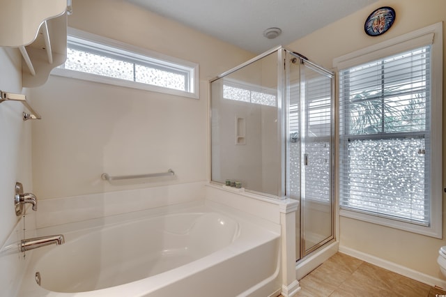 bathroom with toilet, shower with separate bathtub, and tile patterned floors