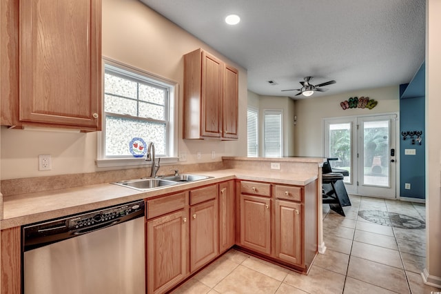 kitchen with a textured ceiling, sink, dishwasher, kitchen peninsula, and ceiling fan