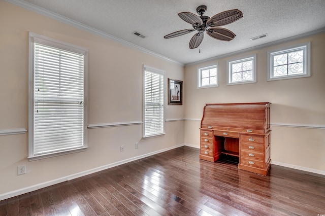 interior space featuring dark hardwood / wood-style flooring, a textured ceiling, a healthy amount of sunlight, and crown molding