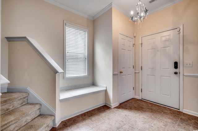 tiled entryway with an inviting chandelier and crown molding