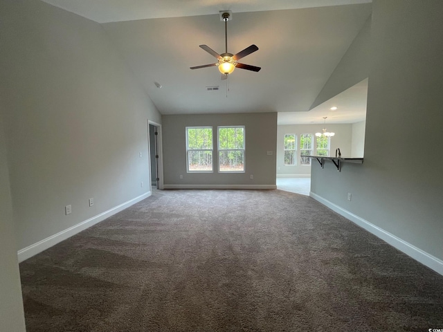 unfurnished living room featuring ceiling fan with notable chandelier, carpet floors, and high vaulted ceiling