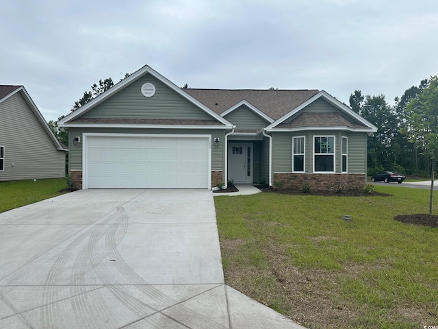 view of front facade featuring a garage and a front lawn