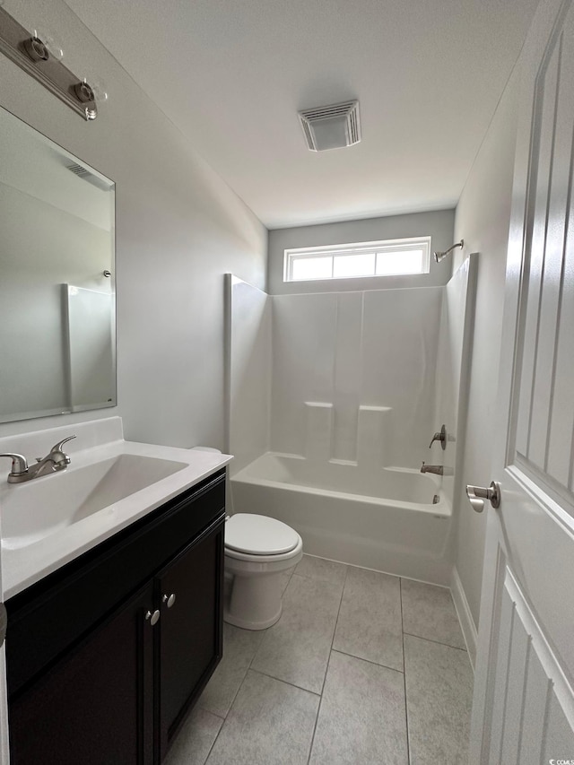 full bathroom with tile patterned flooring, vanity, shower / bathtub combination, and toilet