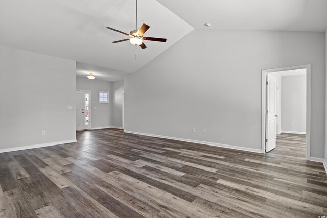 unfurnished living room with ceiling fan, dark hardwood / wood-style floors, and high vaulted ceiling