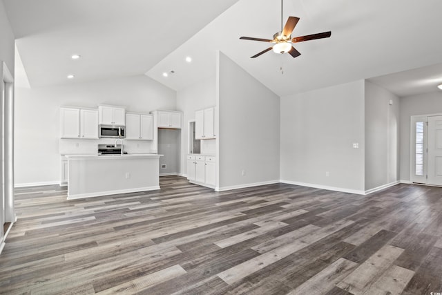 unfurnished living room with light hardwood / wood-style flooring, high vaulted ceiling, and ceiling fan