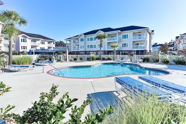 view of swimming pool with a patio