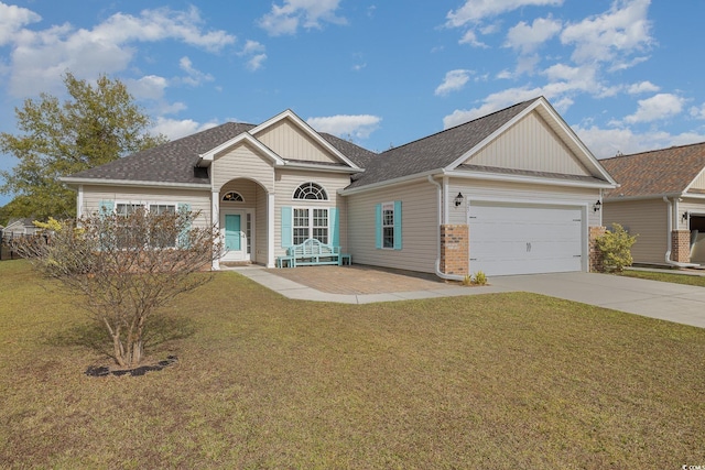 view of front facade featuring a front lawn and a garage