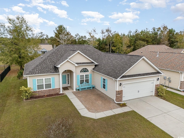 view of front facade with a front lawn and a garage