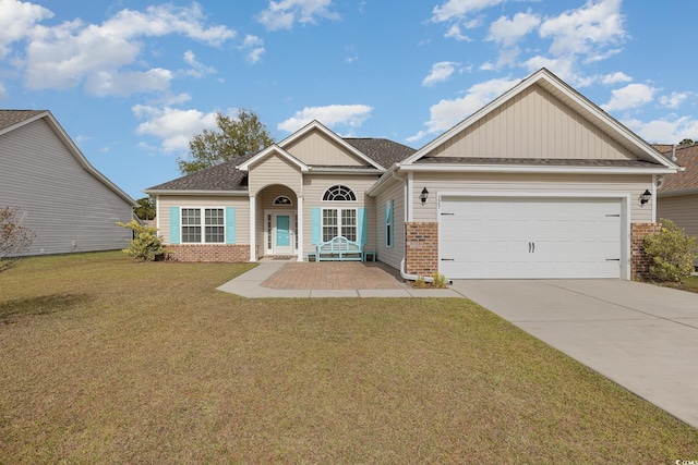 view of front of home featuring a front lawn, a porch, and a garage