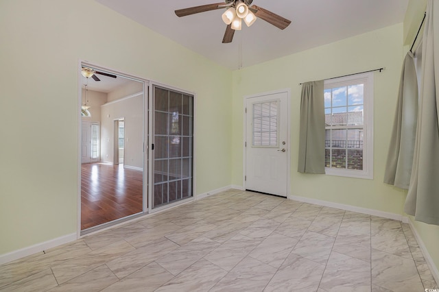 empty room featuring light hardwood / wood-style flooring and ceiling fan