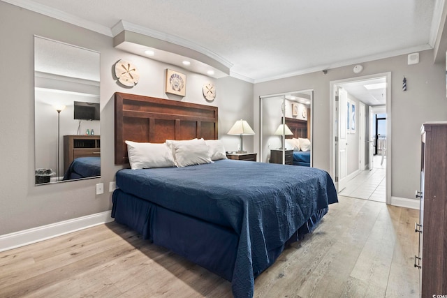 bedroom with light hardwood / wood-style flooring and ornamental molding