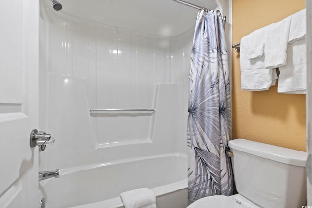 bathroom with shower / tub combo and toilet