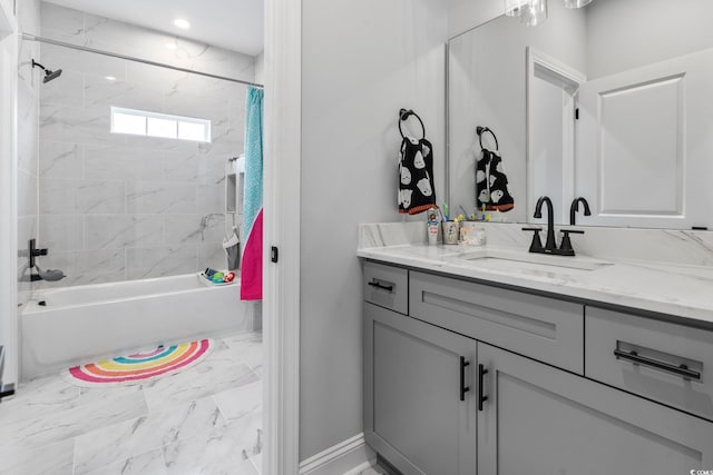 bathroom with vanity, shower / bathtub combination with curtain, and marble finish floor