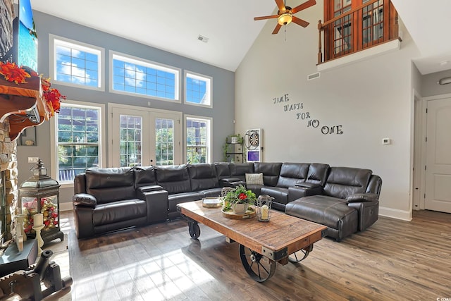 living room featuring high vaulted ceiling, hardwood / wood-style floors, and ceiling fan