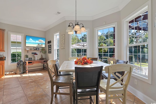 tiled dining room with ornamental molding and a chandelier