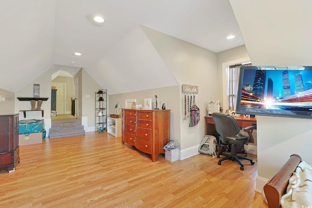 office featuring light hardwood / wood-style floors and lofted ceiling