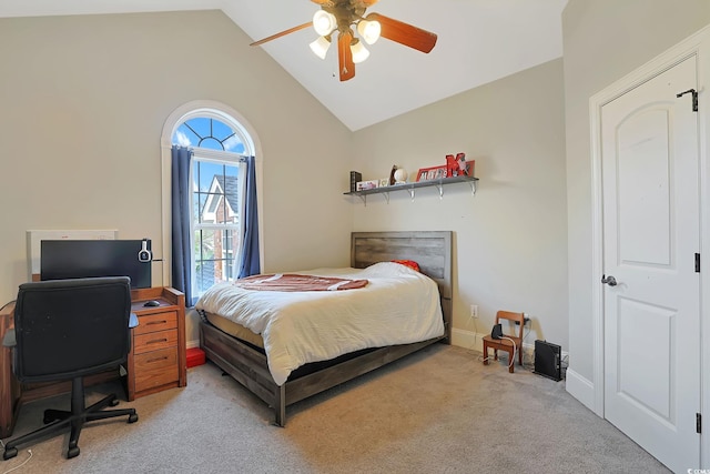 carpeted bedroom with high vaulted ceiling and ceiling fan