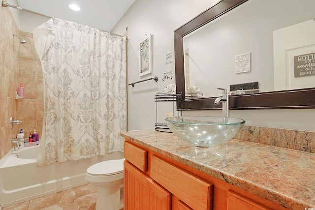 full bathroom featuring toilet, vanity, and shower / bath combination with curtain