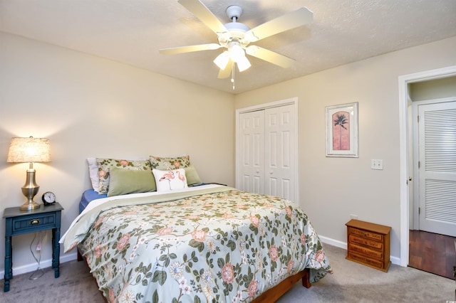 bedroom featuring a closet, light carpet, and ceiling fan