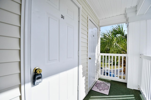 property entrance featuring covered porch