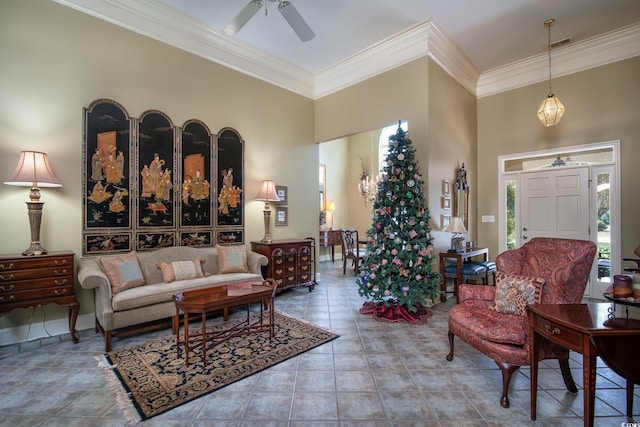 tiled living room featuring a towering ceiling, ceiling fan, and ornamental molding