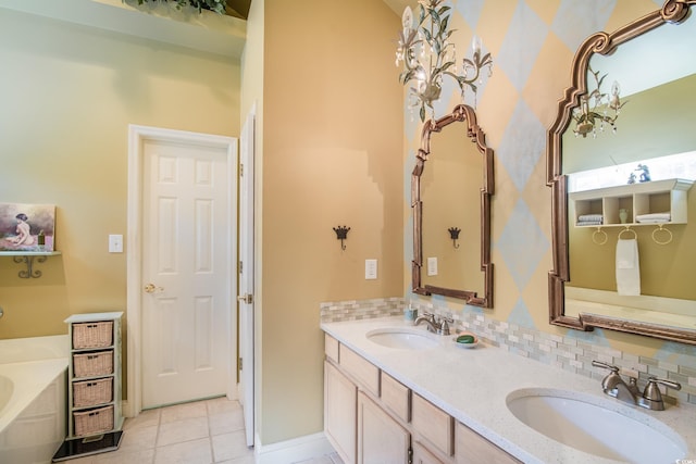 bathroom with a bathtub, tasteful backsplash, vanity, and tile patterned flooring