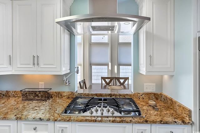 kitchen with white cabinets, stainless steel gas cooktop, and stone counters