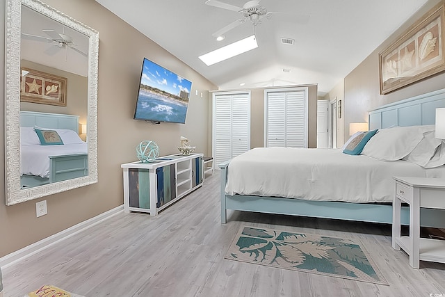 bedroom with light hardwood / wood-style floors, ceiling fan, and lofted ceiling