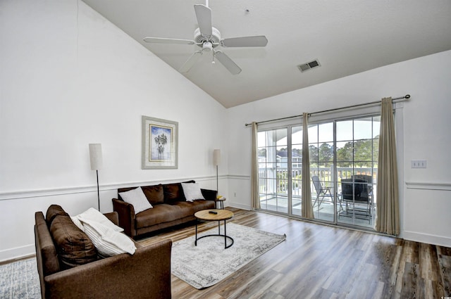 living room featuring high vaulted ceiling, hardwood / wood-style floors, and ceiling fan