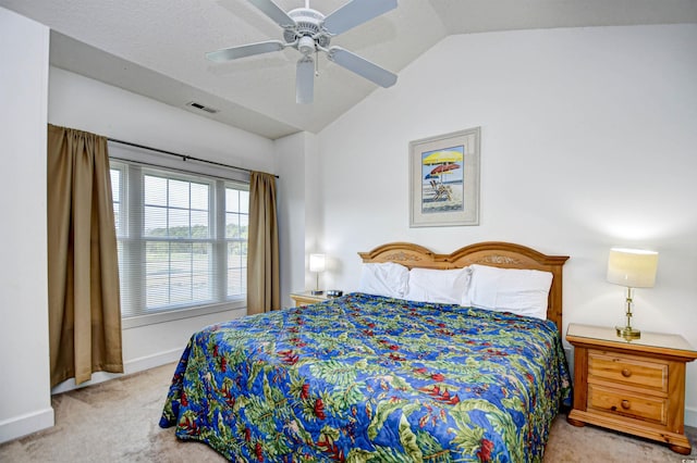 carpeted bedroom featuring lofted ceiling and ceiling fan