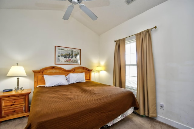 carpeted bedroom featuring lofted ceiling and ceiling fan