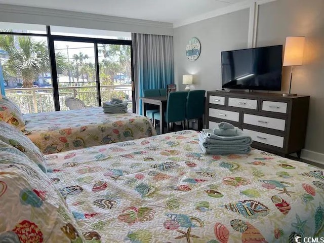 bedroom featuring crown molding and access to outside