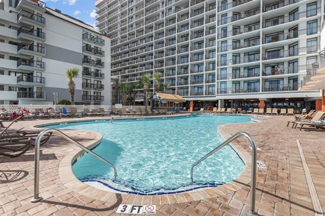 view of swimming pool featuring a patio