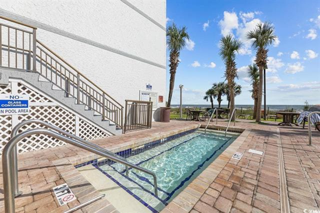 view of pool featuring a patio area